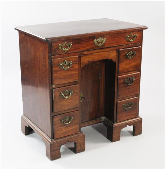 A mid 18th century mahogany kneehole desk, W.2ft 5.5in.